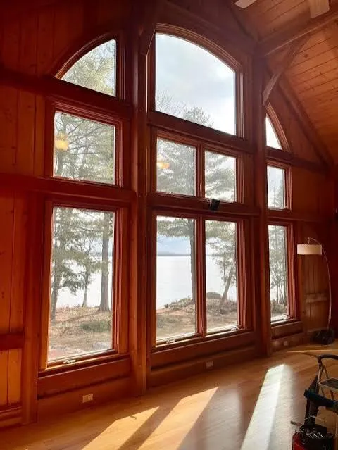 Professional installer applying window film to dining room windows
