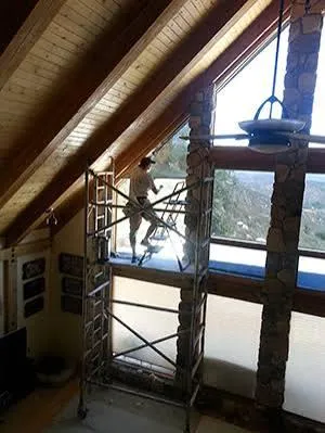 Sun control window tint applied to home windows using scaffold