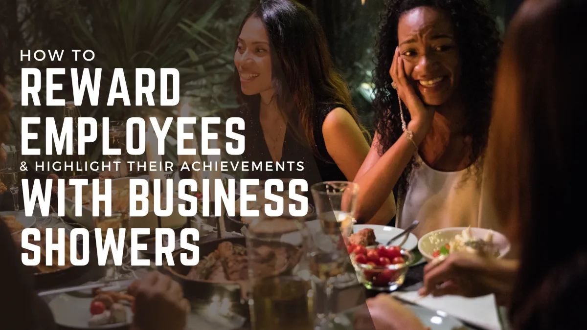 Ethnic women at a business shower dinner party sitting around a table eating food.