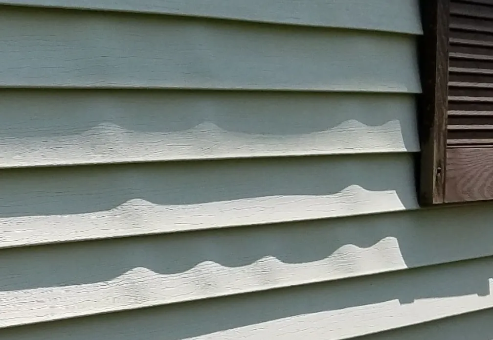 Why Vinyl Siding Buckles in Spring—and What Quad Cities Homeowners Should Know