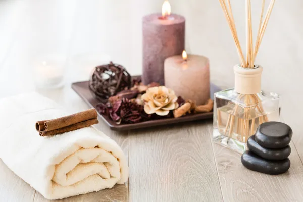 A vibrant and empowering image that celebrates individuality. It could show a person smiling as they use the Mobile Wellness control panel, with a background that creatively visualizes different "ambiance" options (e.g., musical notes, calming colors, nature elements).