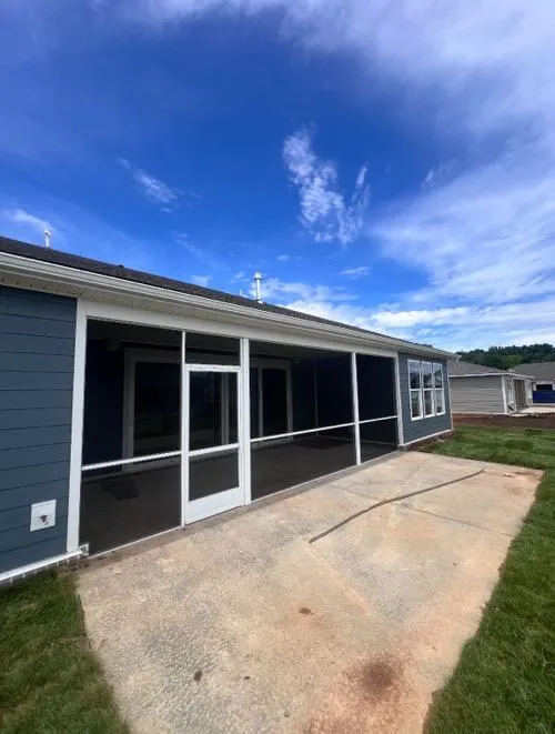 Custom screen porch with gray siding and aluminum frame in Tennessee
