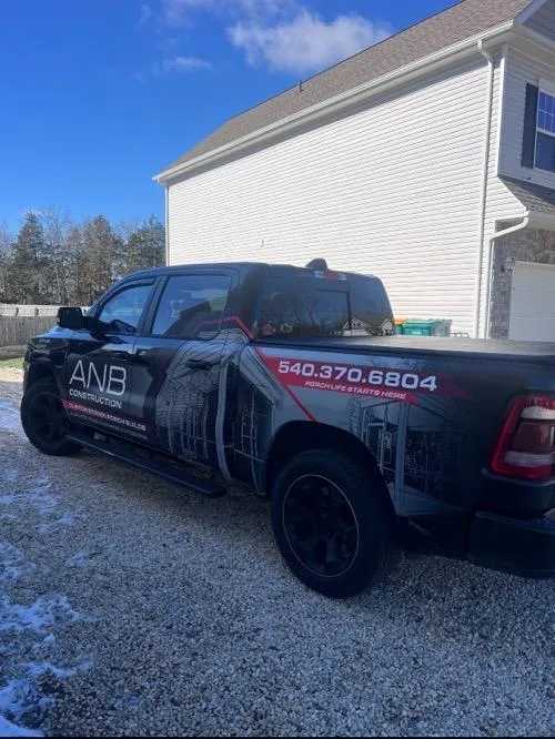 ANB Construction branded truck with logo and contact details
