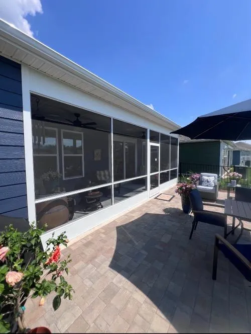 Custom aluminum frame screen porch with patio seating area in Tennessee