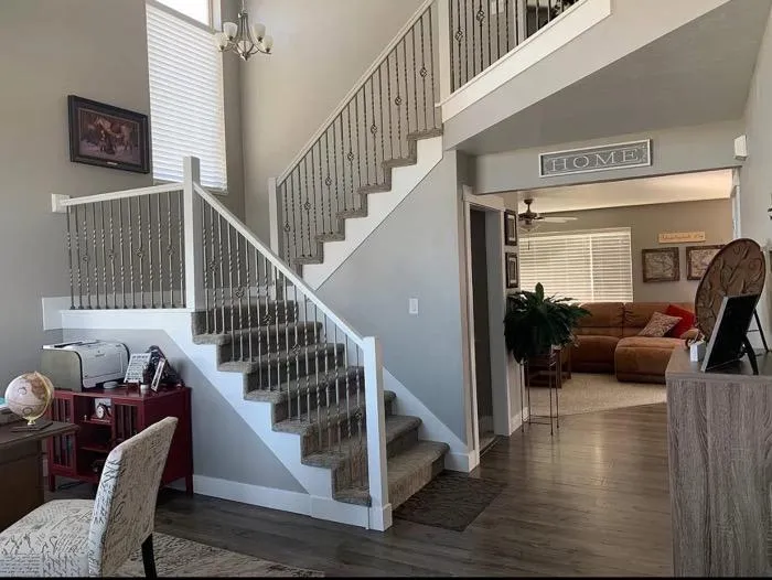 Elegant staircase remodel with carpet steps and open living space in Layton UT