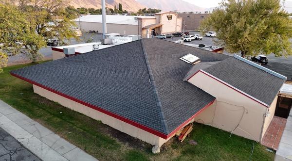 Commercial building with new asphalt shingle roof in Provo, Utah.