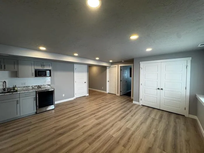 Small bathroom remodel with white vanity and modern lighting in Kaysville UT