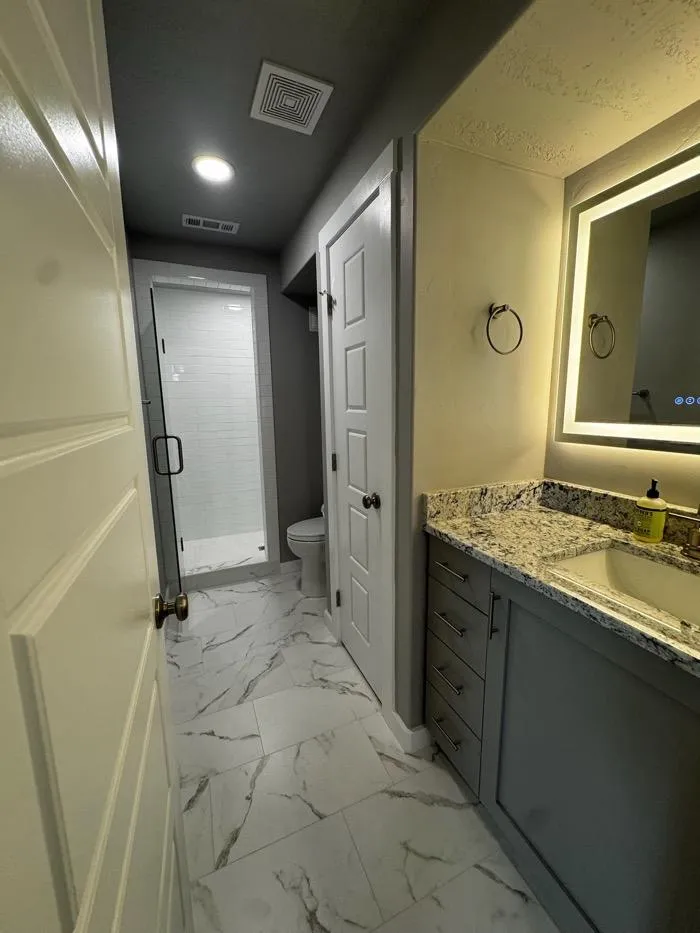 Entryway remodel with hardwood flooring and neutral walls in Roy UT