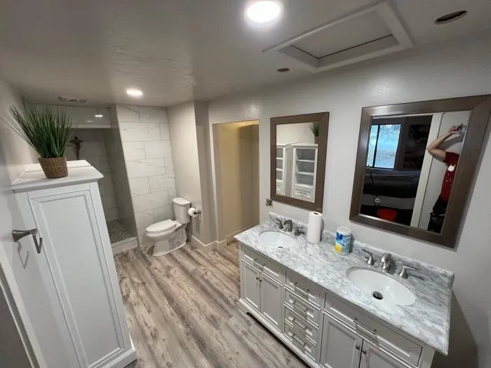 Cozy outdoor deck with pergola and wicker furniture in Farr West UT