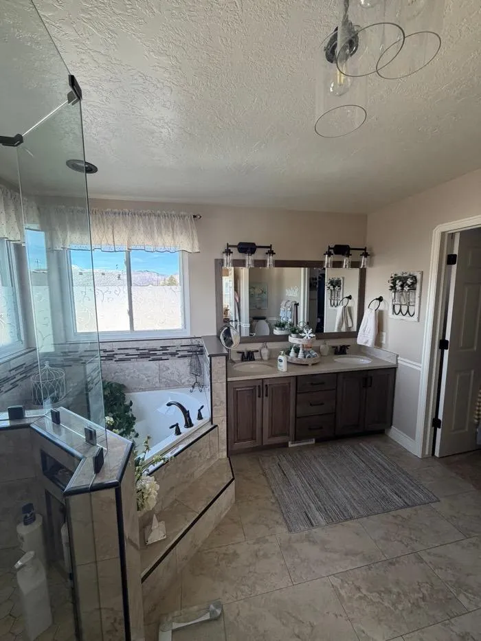 Stylish staircase remodel with black railing and white panel walls in Ogden UT