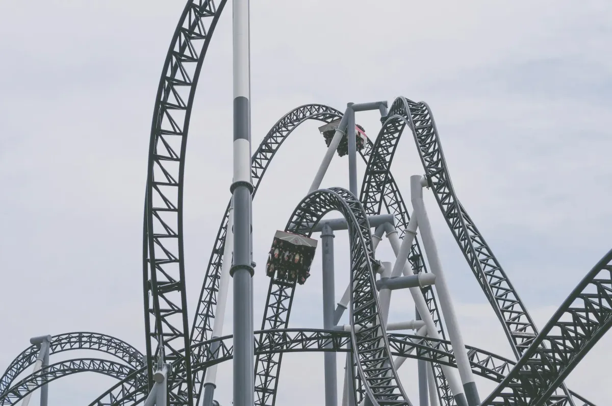 A roller coaster symbolizing the emotional ups and downs of living with unmanaged ADHD.