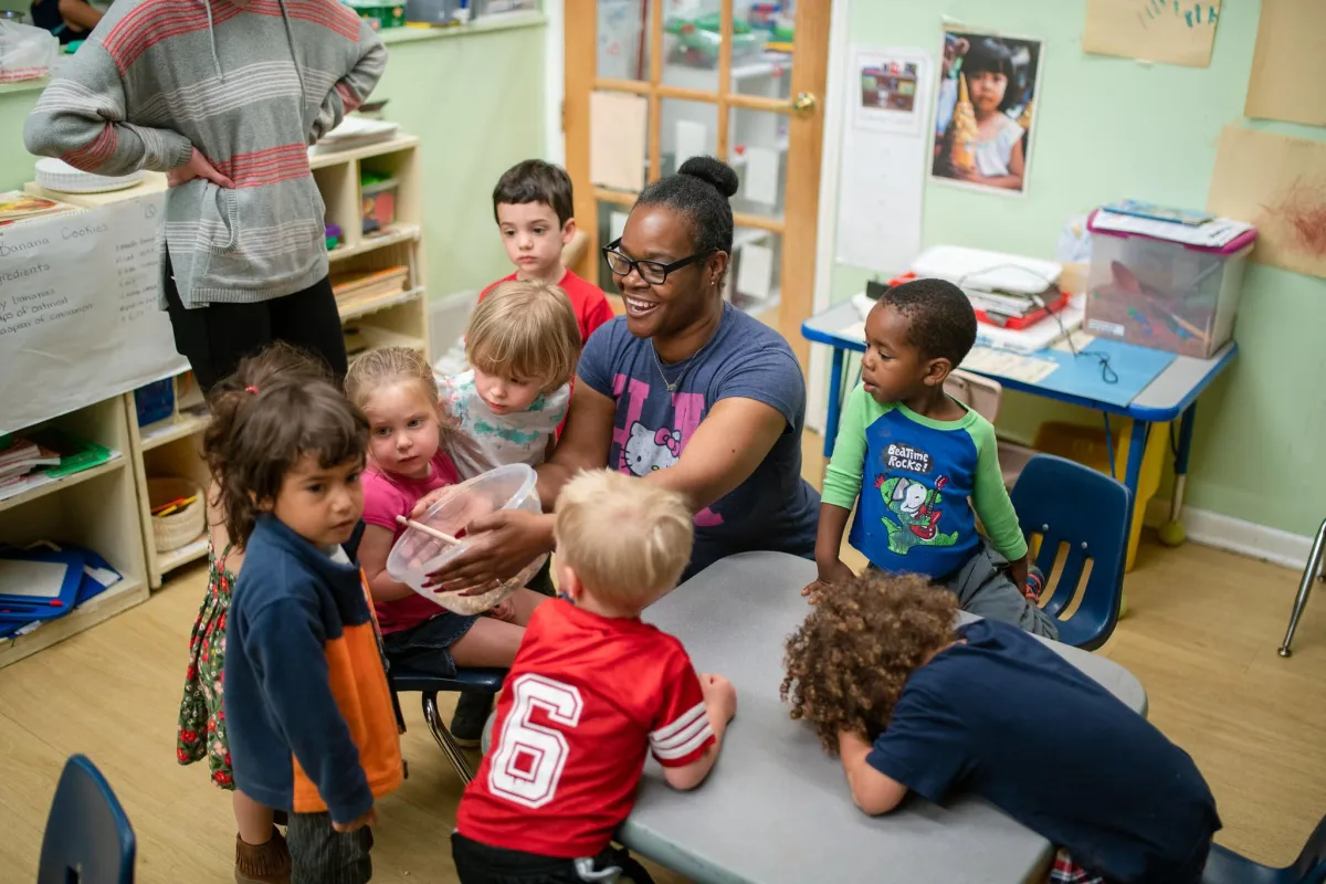 Teacher in classroom with children