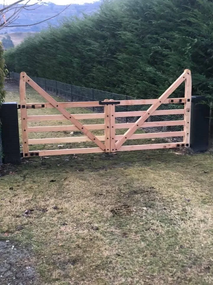 Sturdy wooden gate installation showcasing G A Building’s landscaping expertise