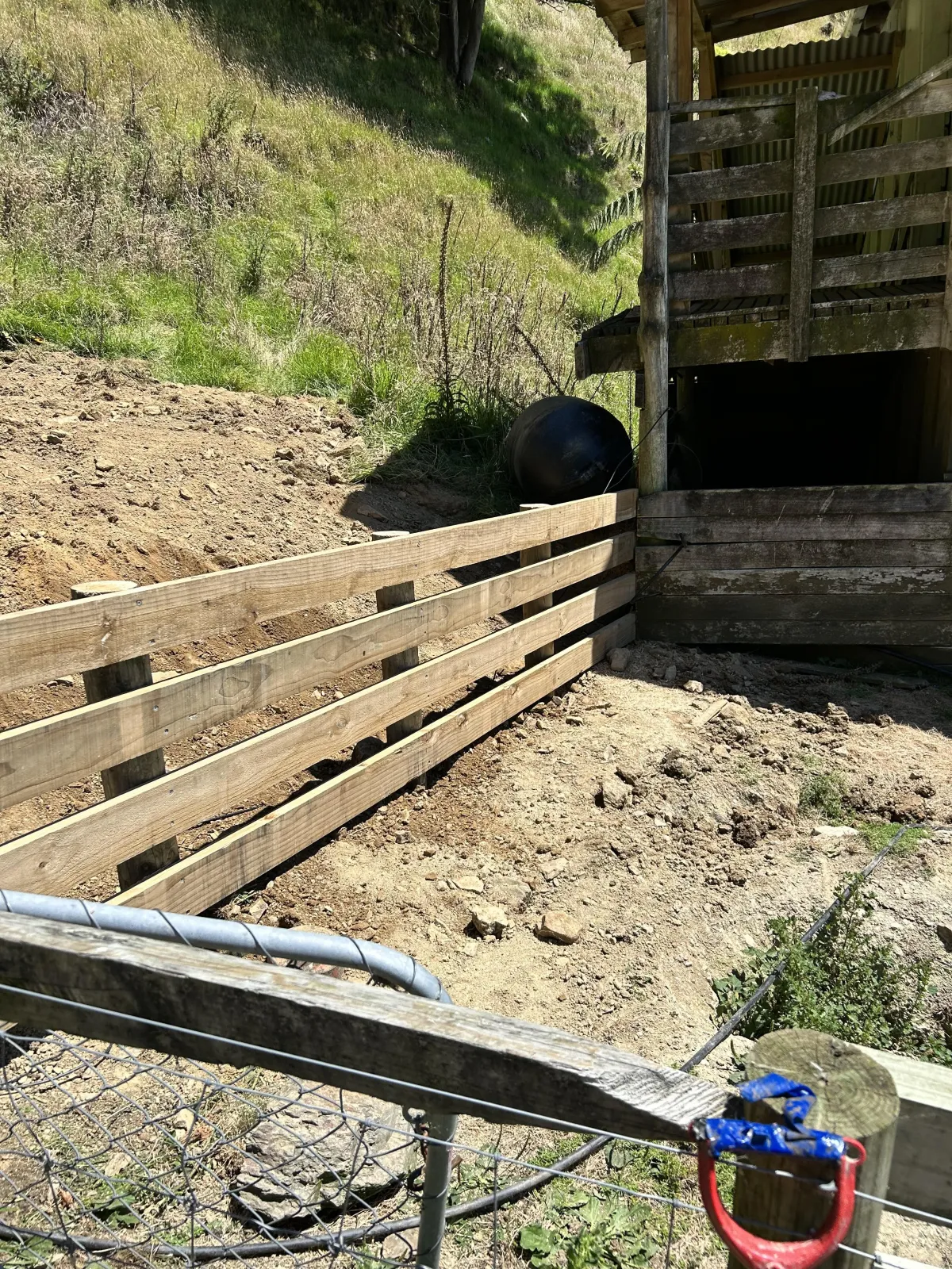 Timber retaining structure securing a sloped backyard in Cromwell by G A Building