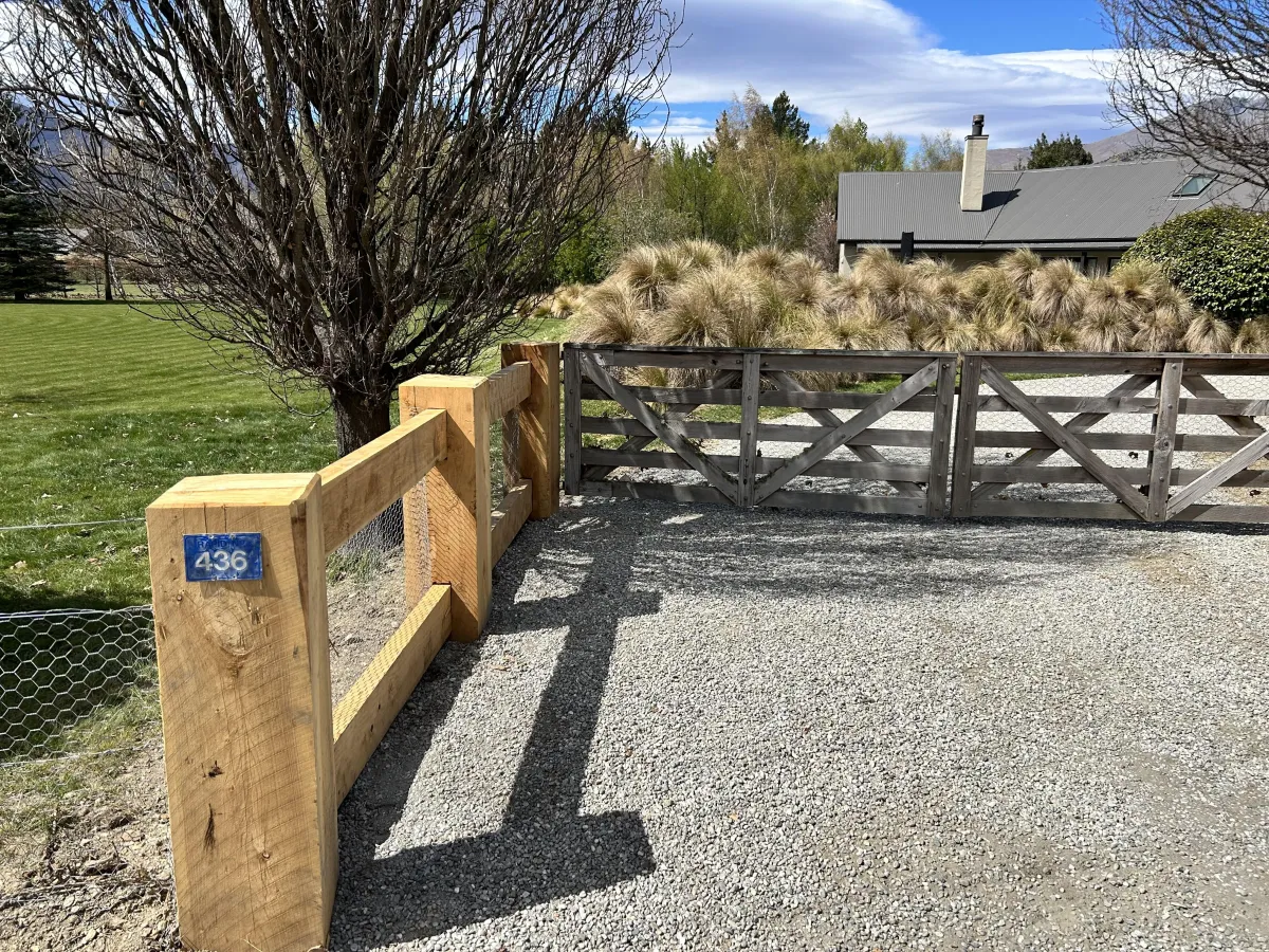 Residential property with gravel path undergoing exterior improvements by G A Building