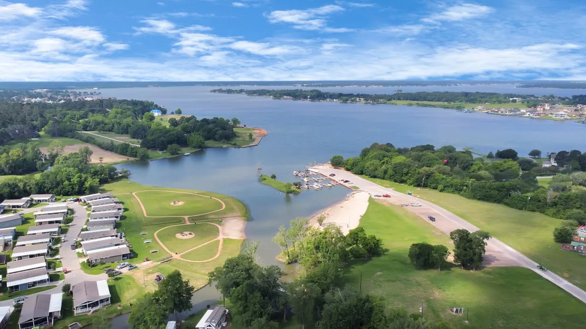 Experience the breathtaking beauty of Montgomery's Lake Conroe from above with stunning aerial pictures that capture the serene expanse of the lake against the backdrop of lush landscapes.