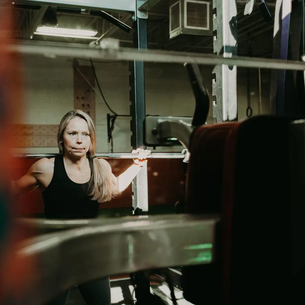 Woman in back squat position