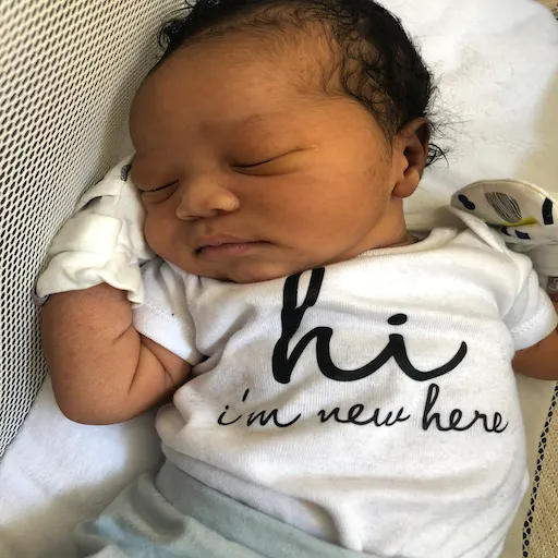 Ryan's as a baby with t-shirt I'm New