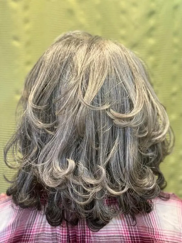 Gracefully styled grey hair with professional blowout