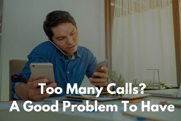 A man answering a lot of phones from multiple leads coming