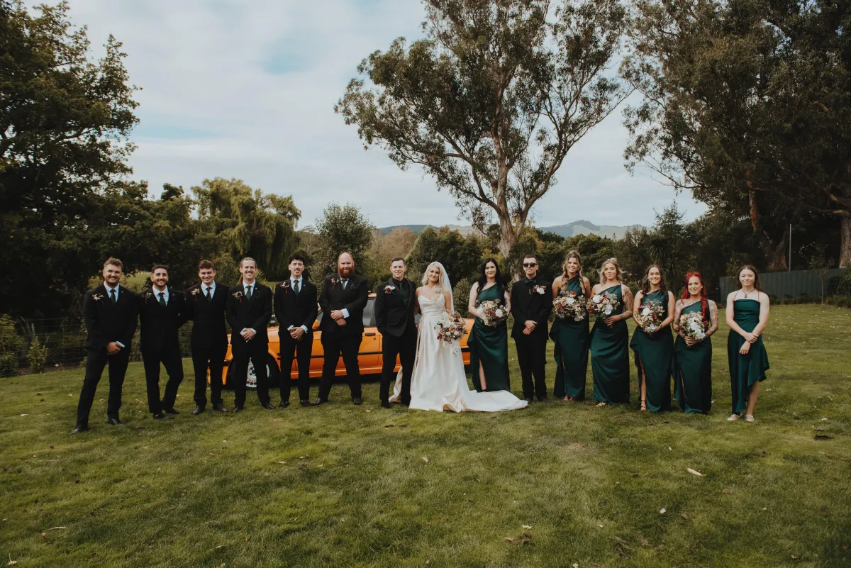Bridal Party group photograph outside the tai tapu hotel