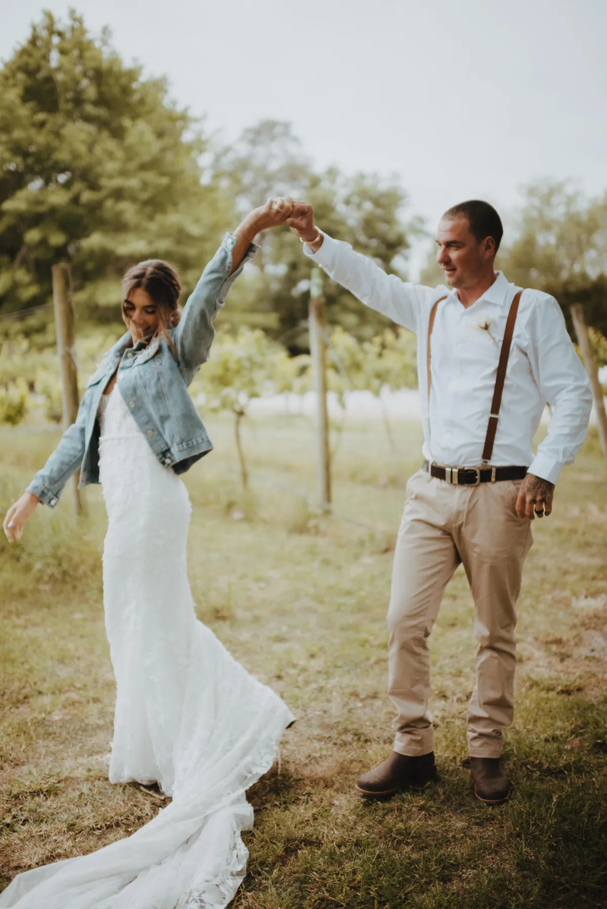 Dancing couple for newlywed portraits in Darjon vineyard