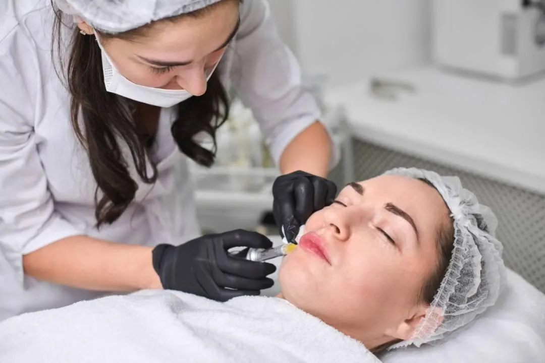 Close-up of injectable dermal filler procedure on patient’s face, representing suitable candidates for treatment.