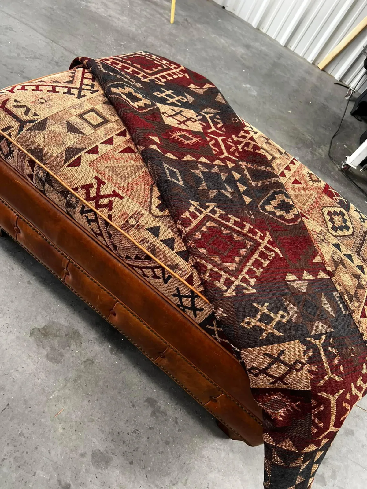 Old patterened no back-rest seat