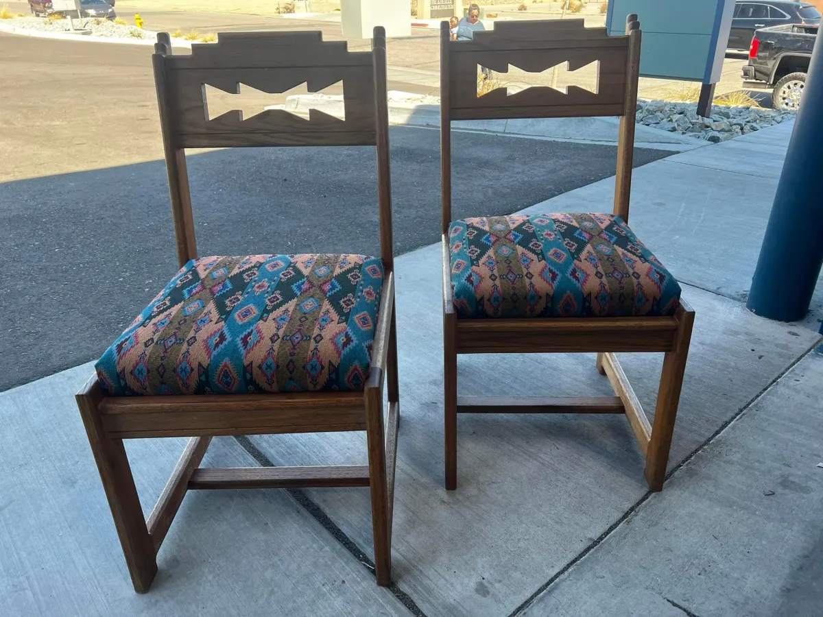 Pair of dining chairs outside for display