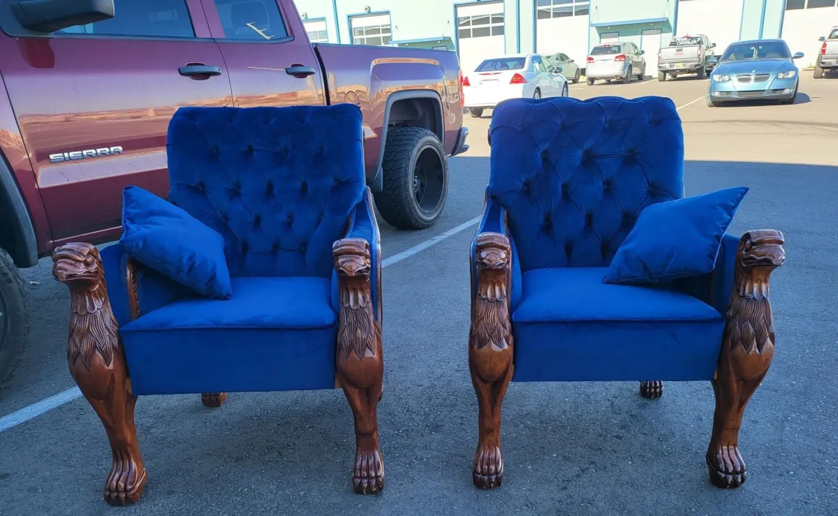 Pair of classic blue velvet seats in parking area