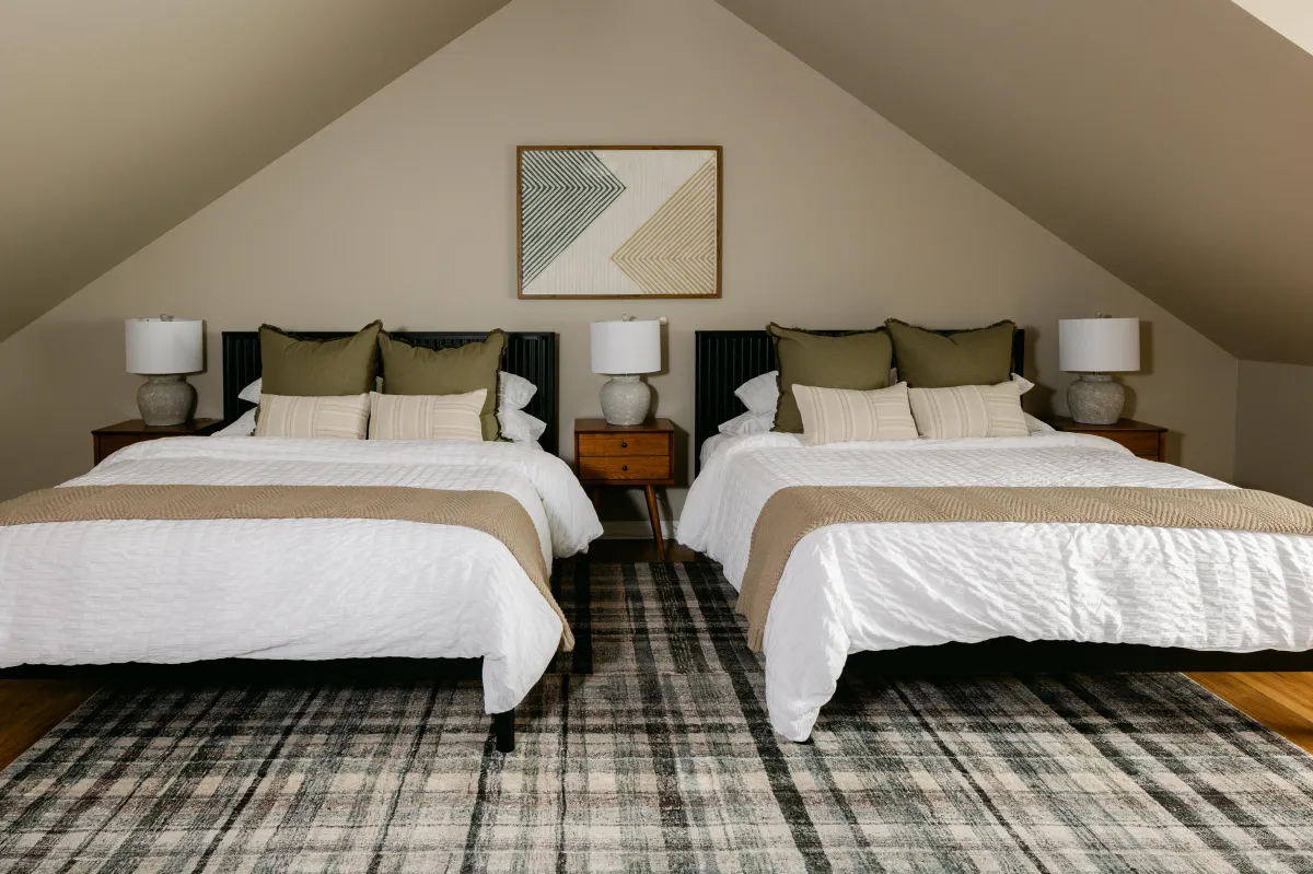 2 queen beds in the spacious upstairs suite