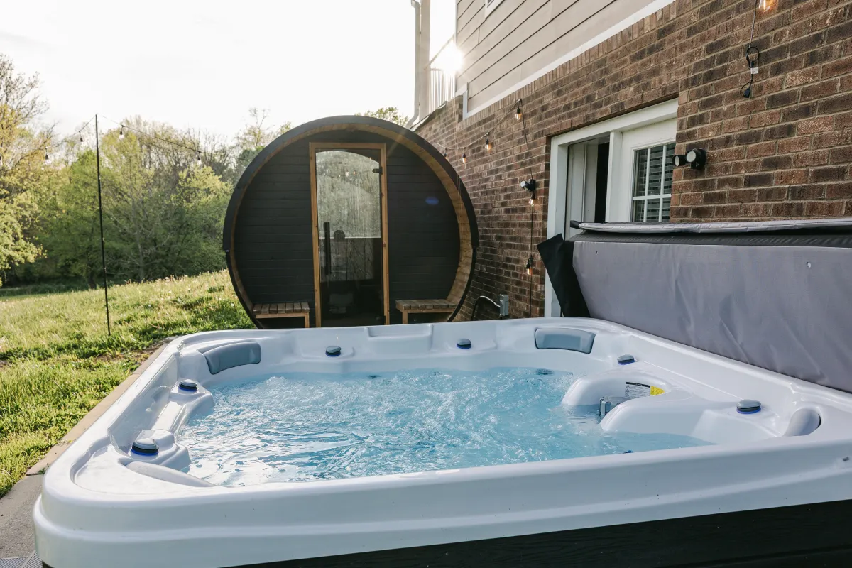 Hot tub and barrel sauna off the downstairs living area