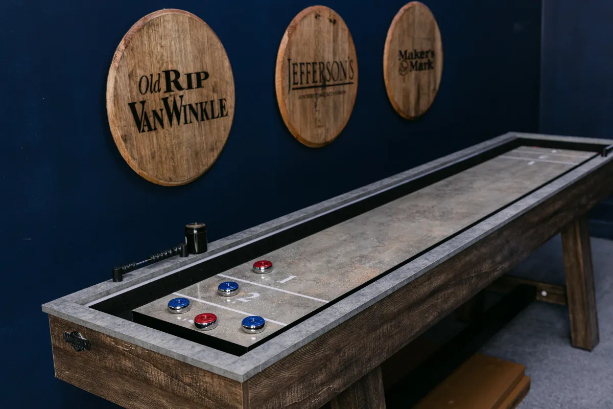 Dedicated game room has fun options, like shufftleboard