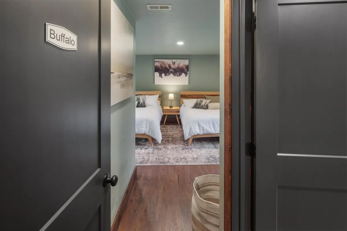 Take a peek inside the Buffalo room, featuring two king beds and lower-level views of the wooded lot, Flathead River, and Rocky Mountains. A cozy, Western-themed retreat in this luxury Montana lodge near Glacier National Park.