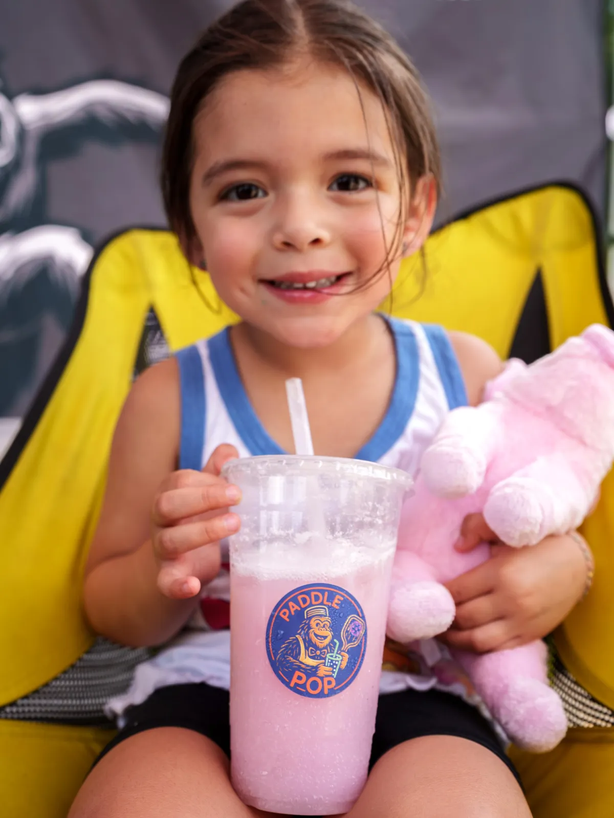 a little girl enjoying a Paddle & Pop drink