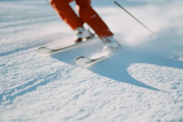 skiing down a snow covered mountain
