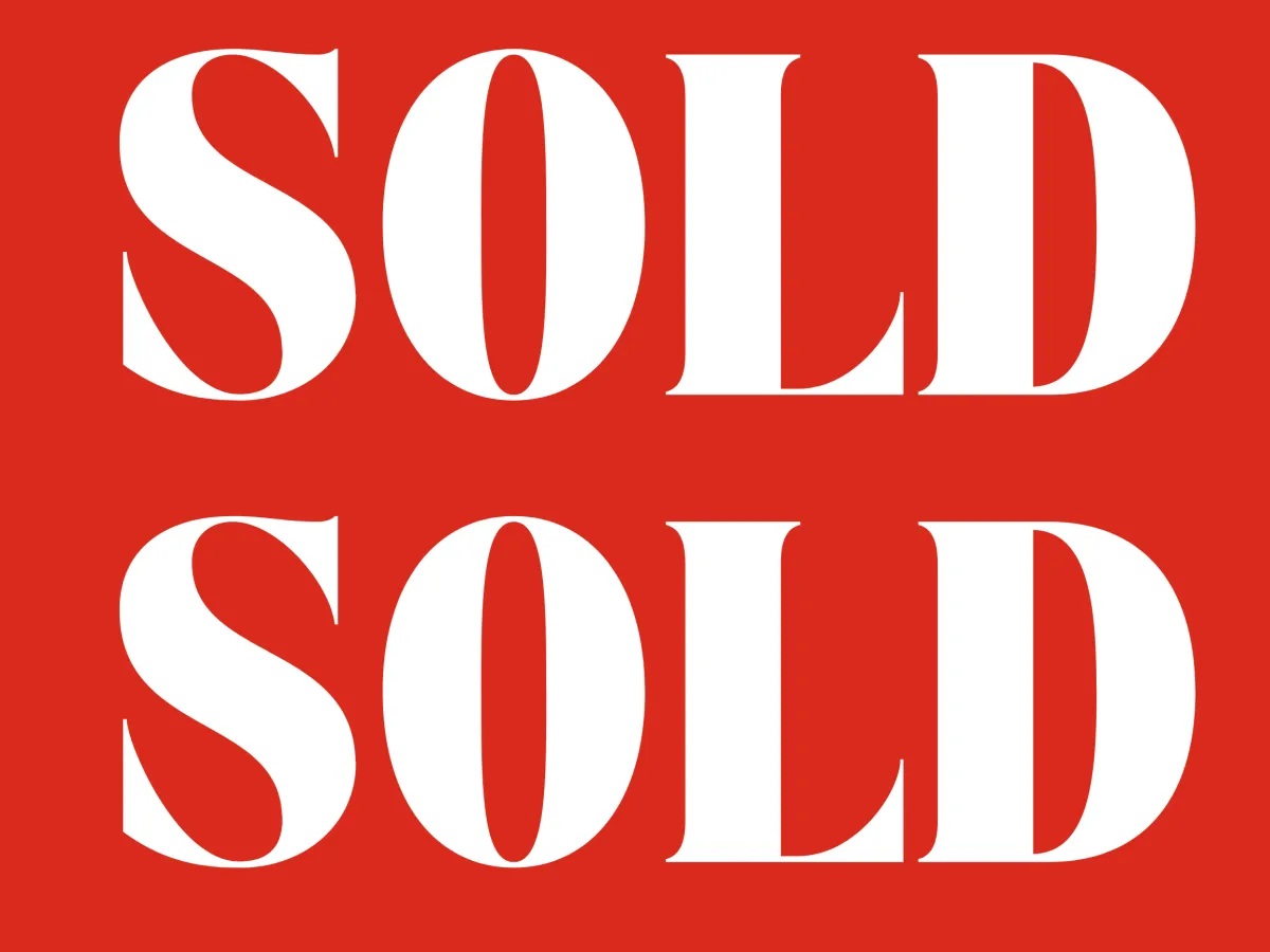 Red sign displaying SOLD in white letters