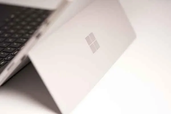 White laptop computer on a white table
