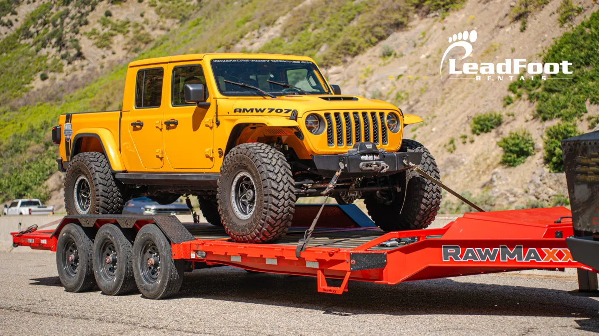 Trailer towing a Jeep