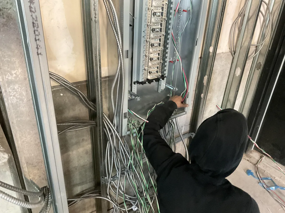 Mountain Man Electric installing electrical components and performing wiring work in a commercial property in Denver, Colorado