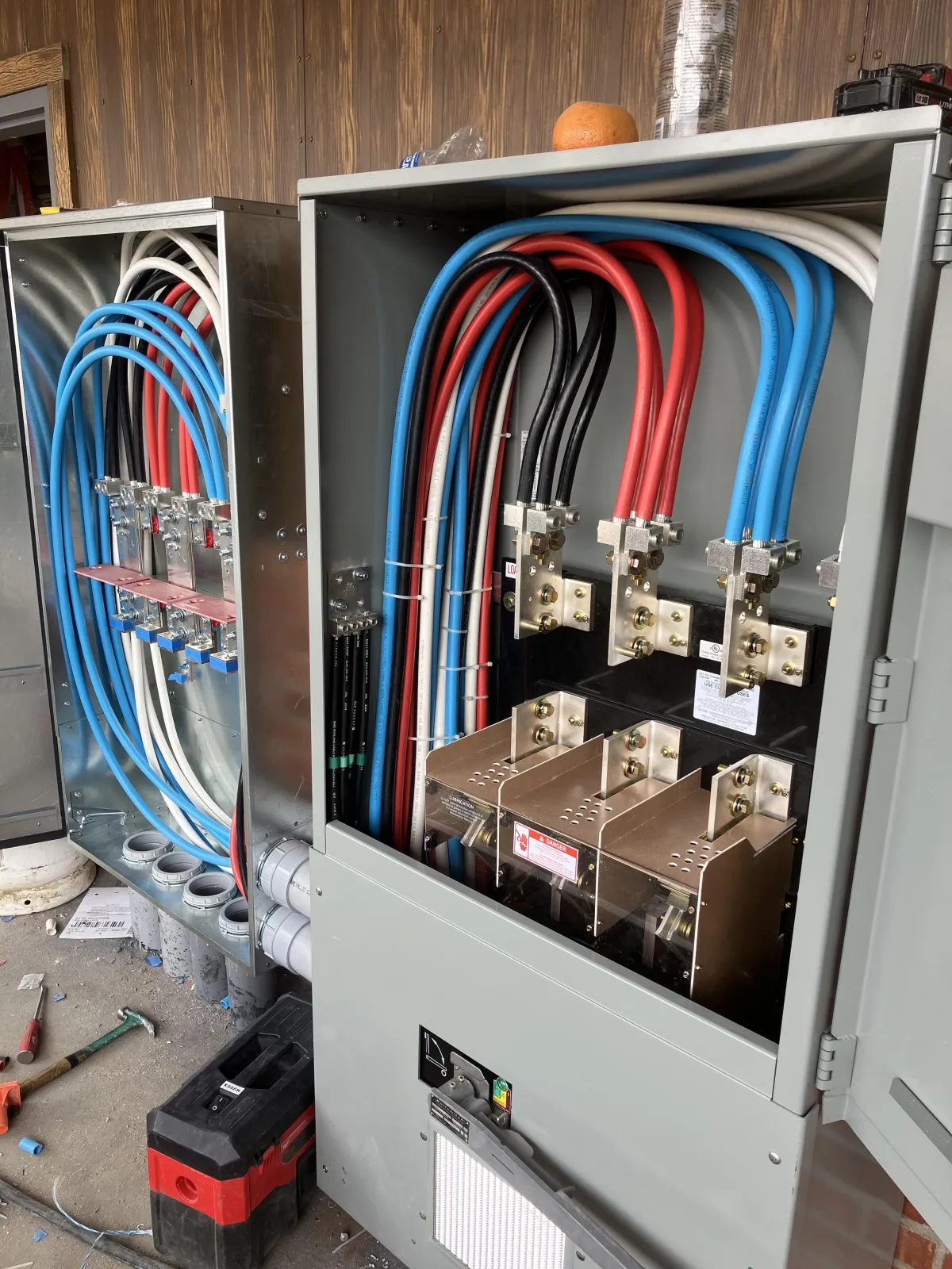Close-up of an expertly wired electrical panel by Mountain Man Electric with multi-colored wires in a Denver home