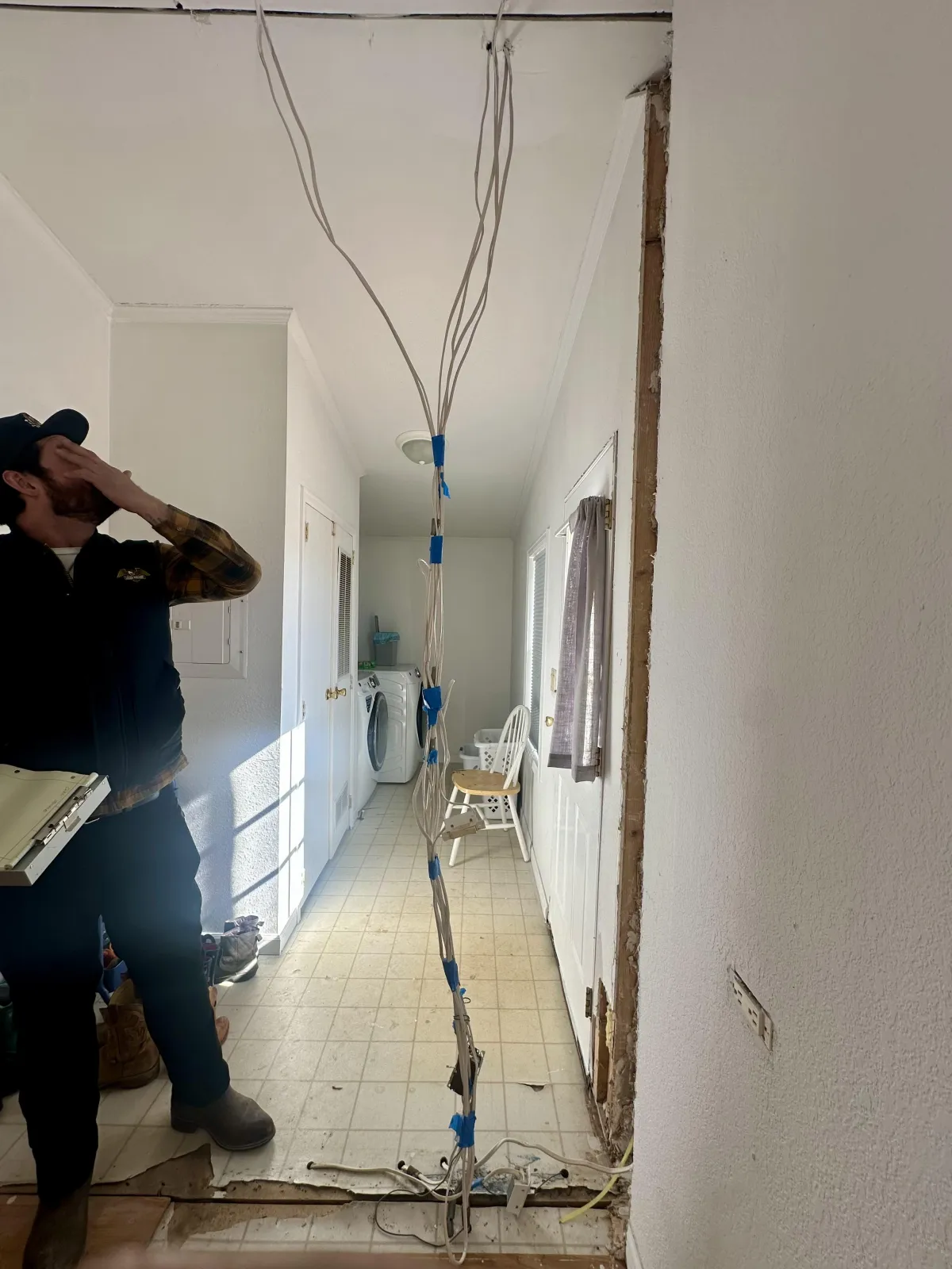 Mountain Man Electric electrician installing electrical wiring inside a residential home in Denver, Colorado