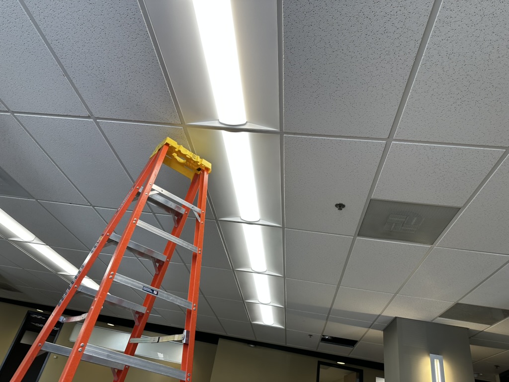 Mountain Man Electric installing energy-efficient LED lights and ceiling tiles in a commercial space in Denver