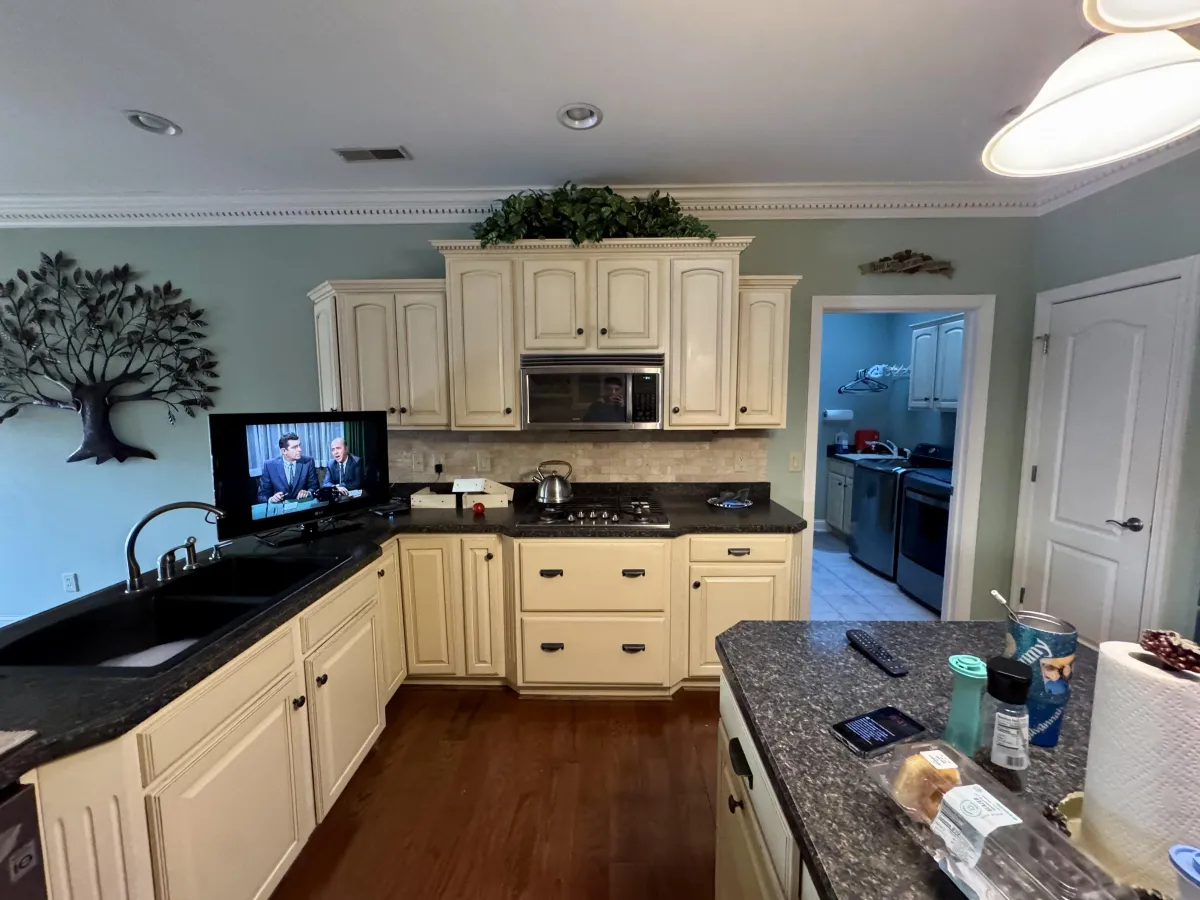 Freshly painted white kitchen cabinets in Louisville KY by PM Painting LLC