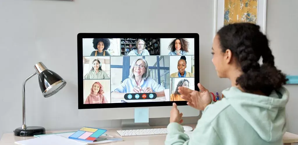 Virtual support professional assisting a business remotely via laptop