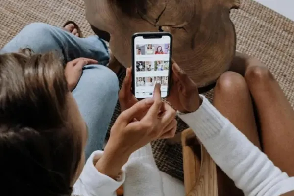 Two women looking at a phone