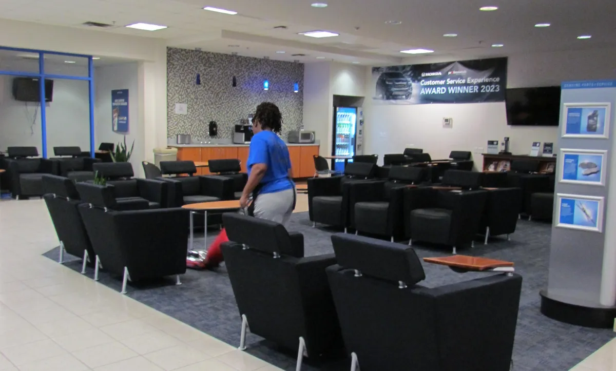 A3D Team member thoroughly cleaning a Phoenix Car Dealership Lobby