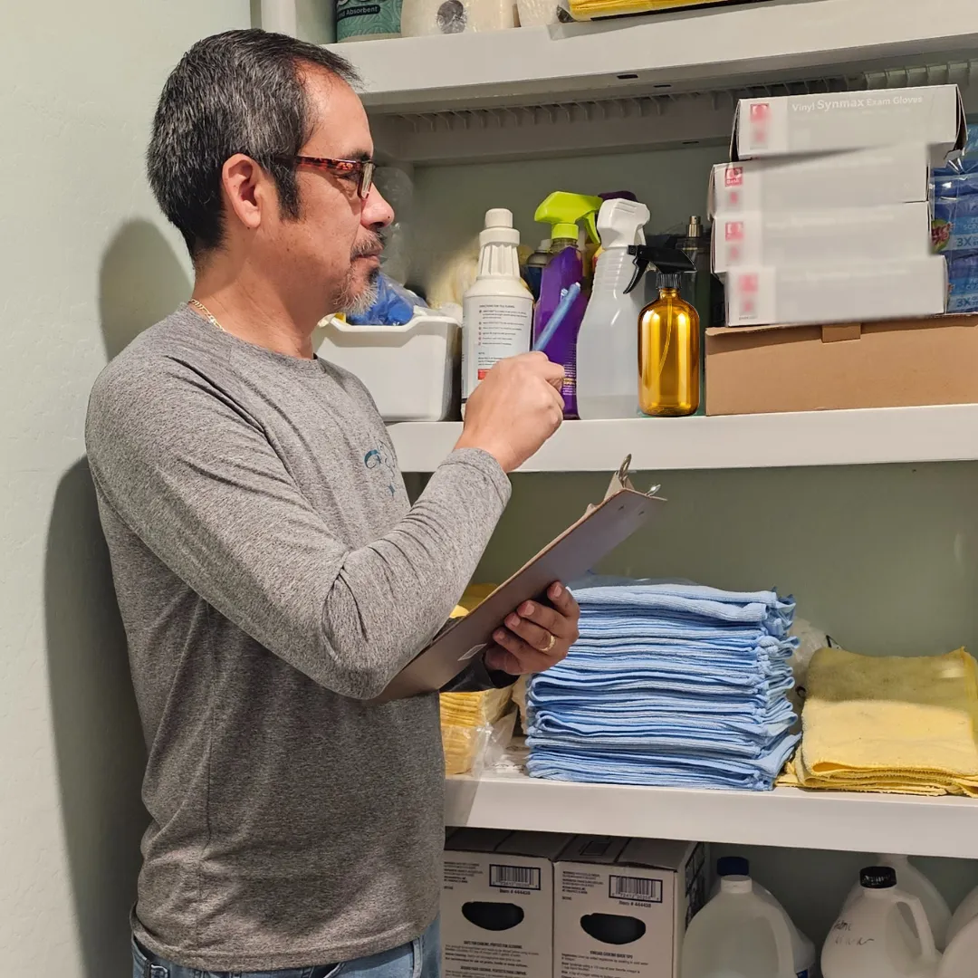 A3D Services employee reviewing cleaning stock for a commercial client — ensuring consistent, holistic facility care and reliability