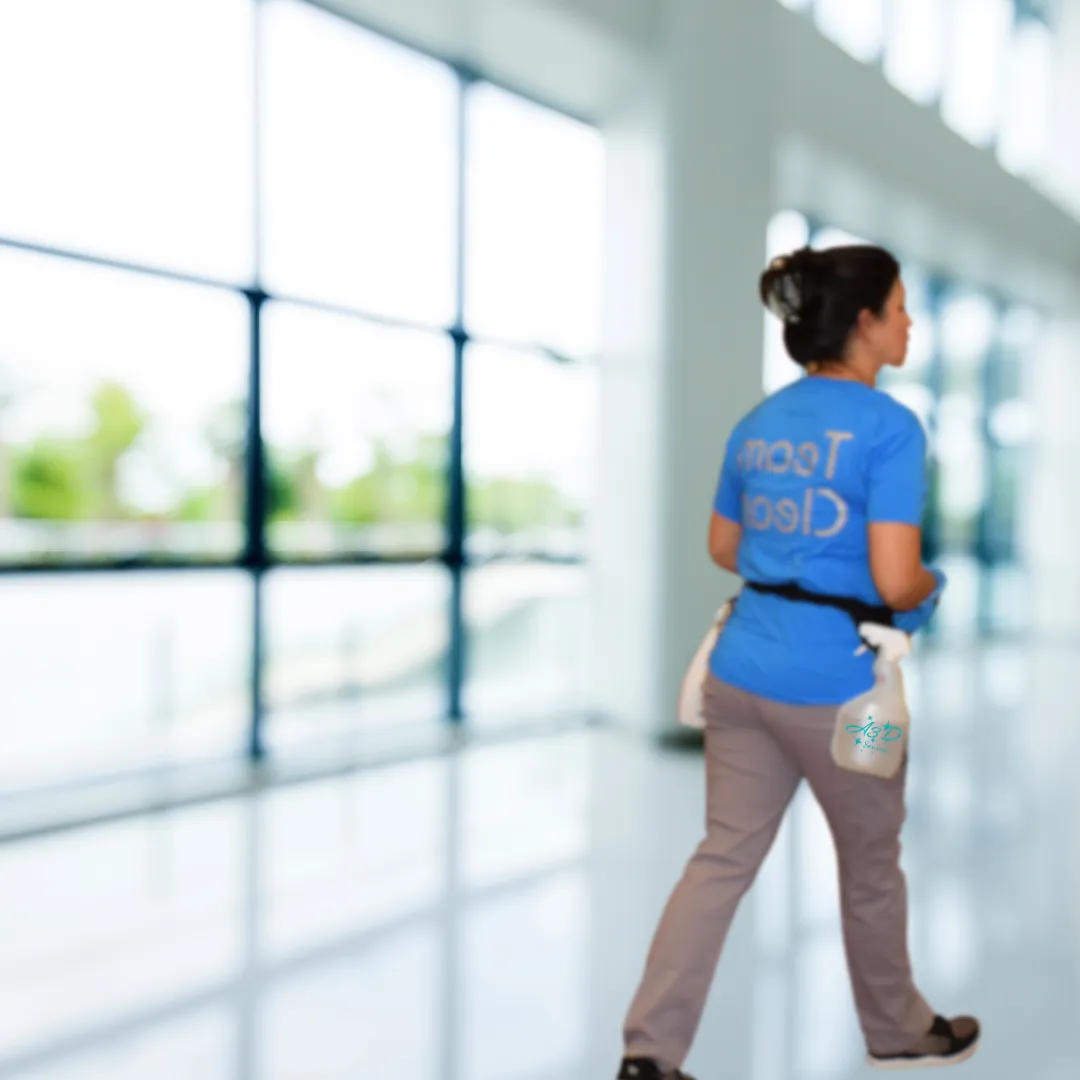 A3D Services employee walking through a clean, bright commercial space — representing professional, holistic facility care in Arizona.