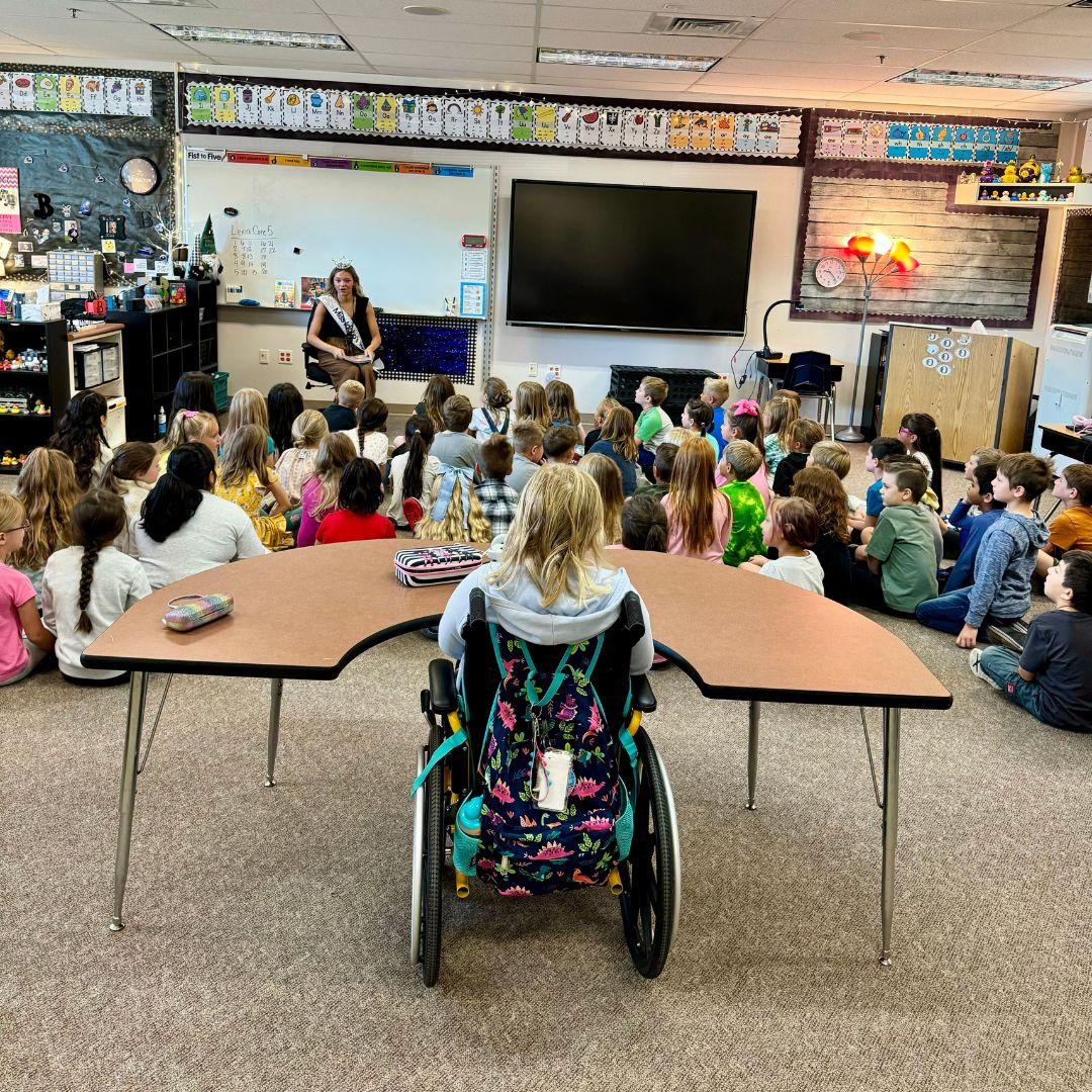 Reading a book about Kindness to a classroom